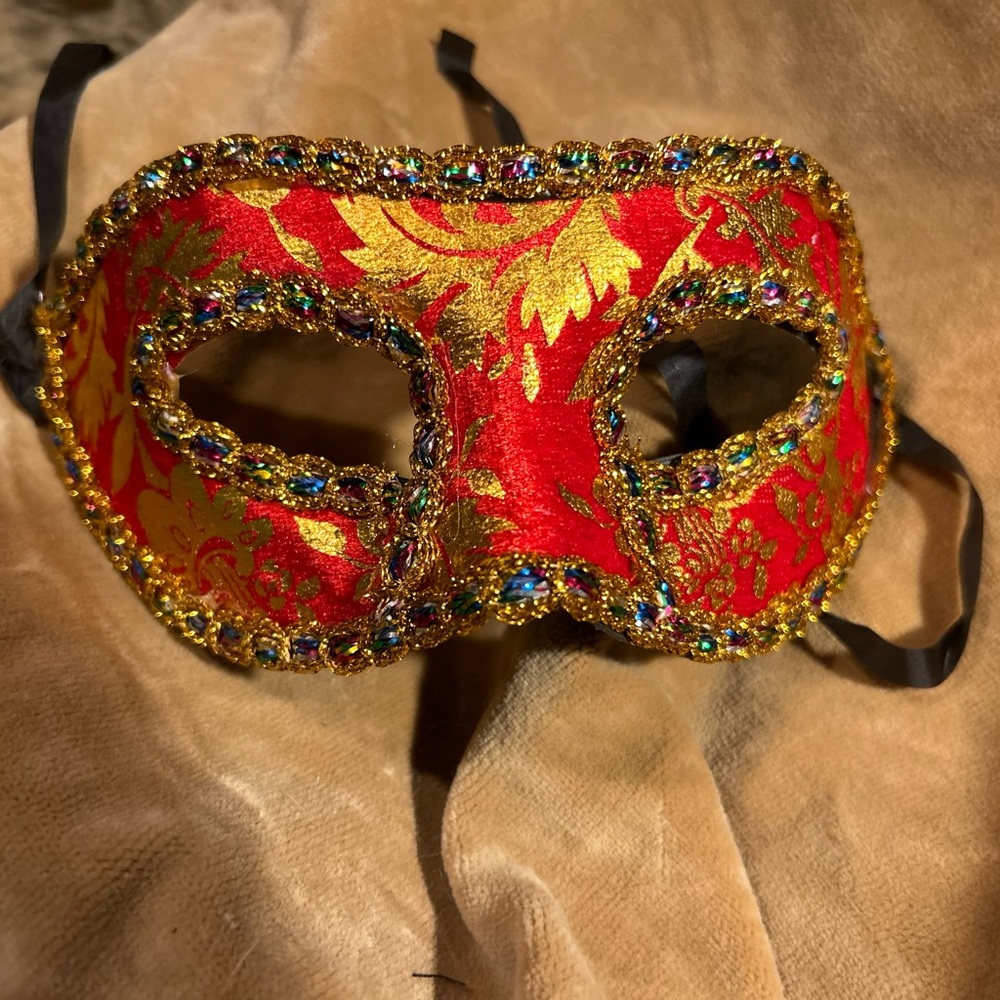 Mardi Gras mask brand new in the package. I have two styles